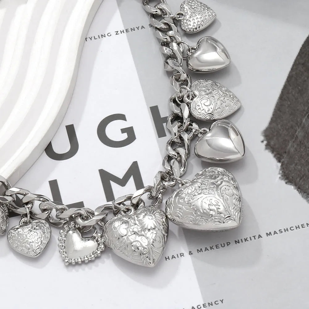 Exaggerated carved heart pendant necklace in gold or white K on an adjustable metal chain.