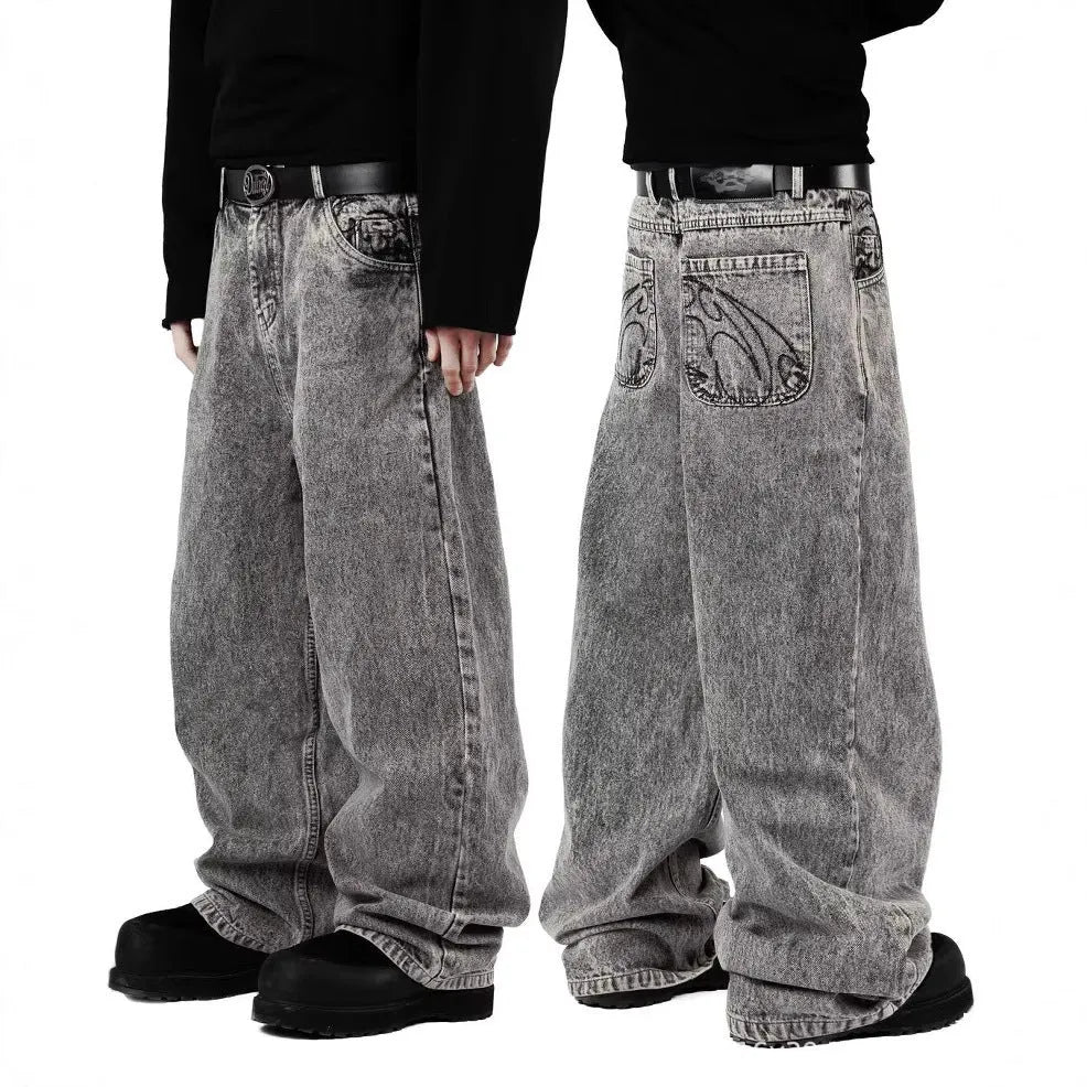 Grey loose fit straight leg denim trousers for men and women laid flat