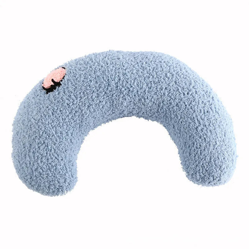 Small blue U-shaped plush pillow for cats or small dogs on a white background.