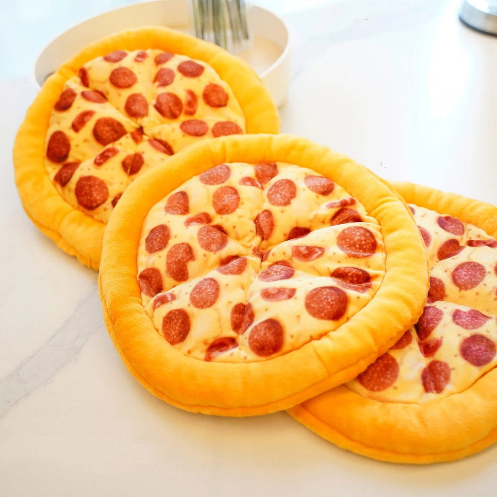Yellow pizza-shaped squeaky dog toy for teeth grinding and chewing
