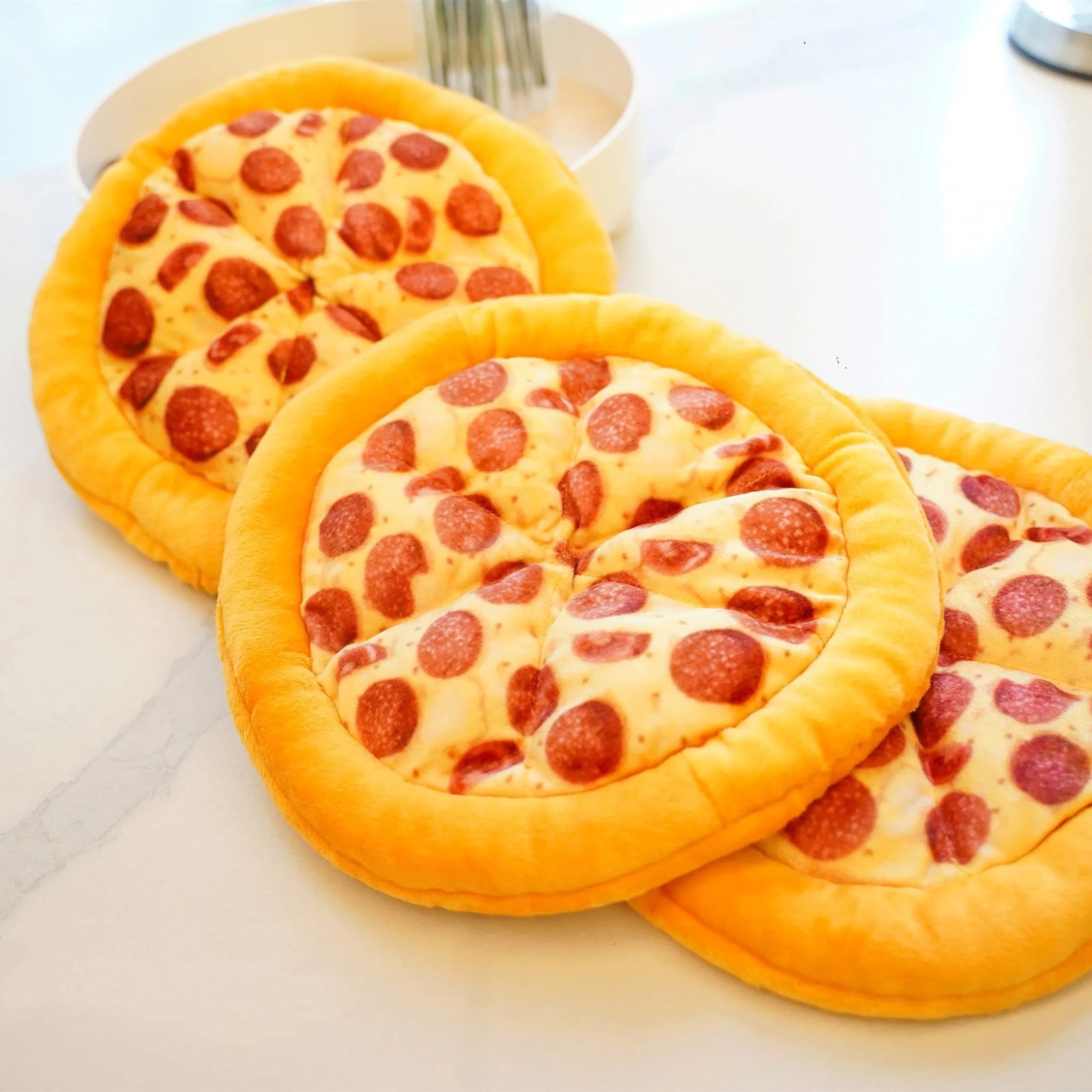 Yellow pizza-shaped squeaky dog toy for teeth grinding and chewing
