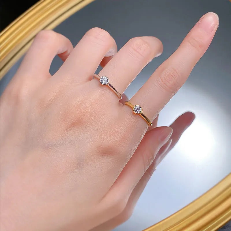 Minimalist crown-shaped silver ring with line detailing, shown in electroplated gold and platinum finishes