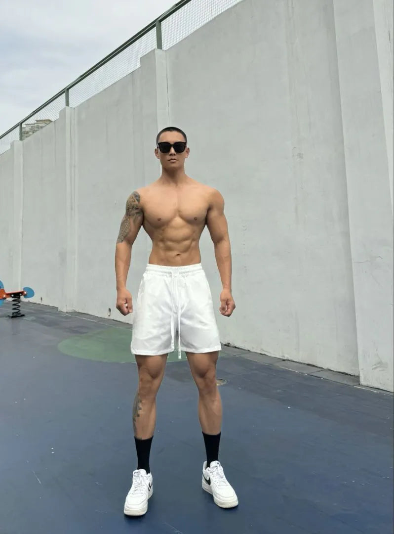 Men's quick-drying double-layer nylon shorts shown in multiple colours.