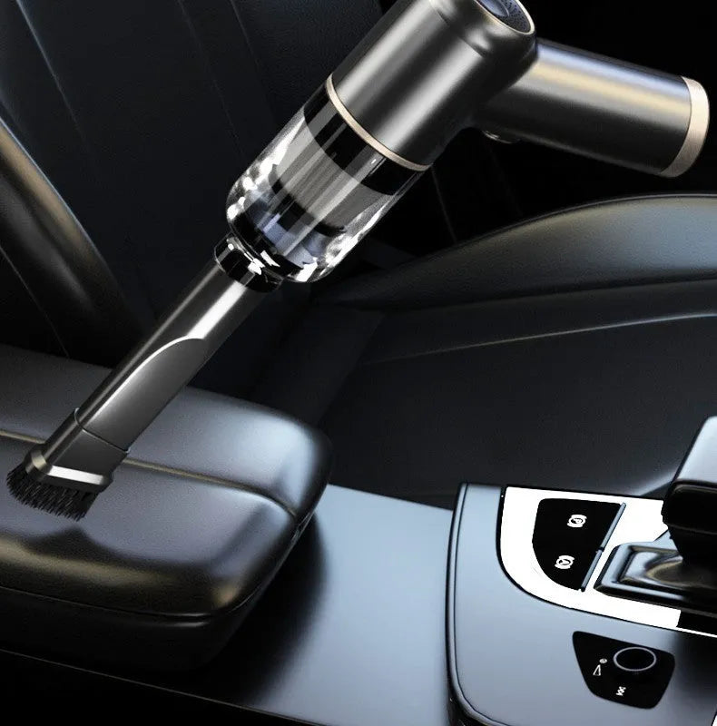 Black wireless handheld car vacuum cleaner with nozzle attachments and USB cable