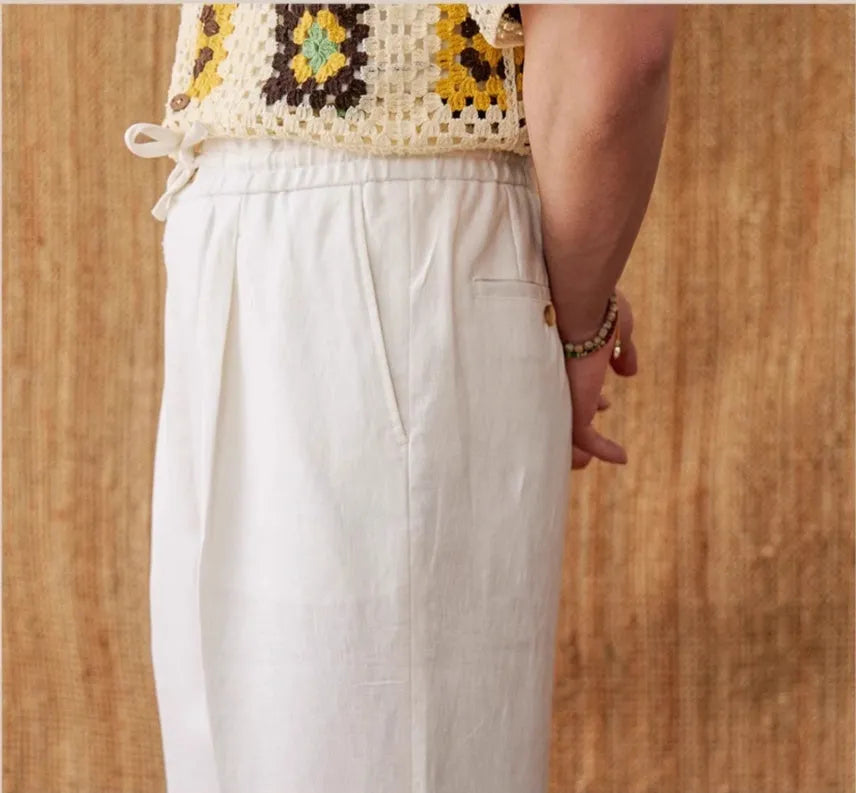 Straight-leg linen trousers with elasticated high waistband in navy blue, white, and greige colours