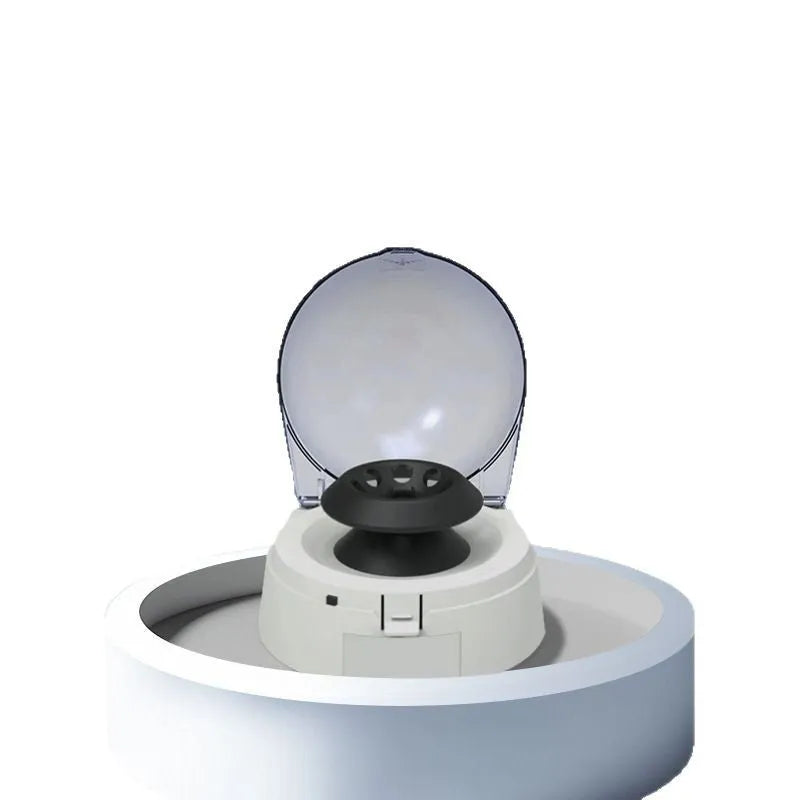 Compact mini laboratory centrifuge on benchtop showing 157mm width and 170mm height dimensions