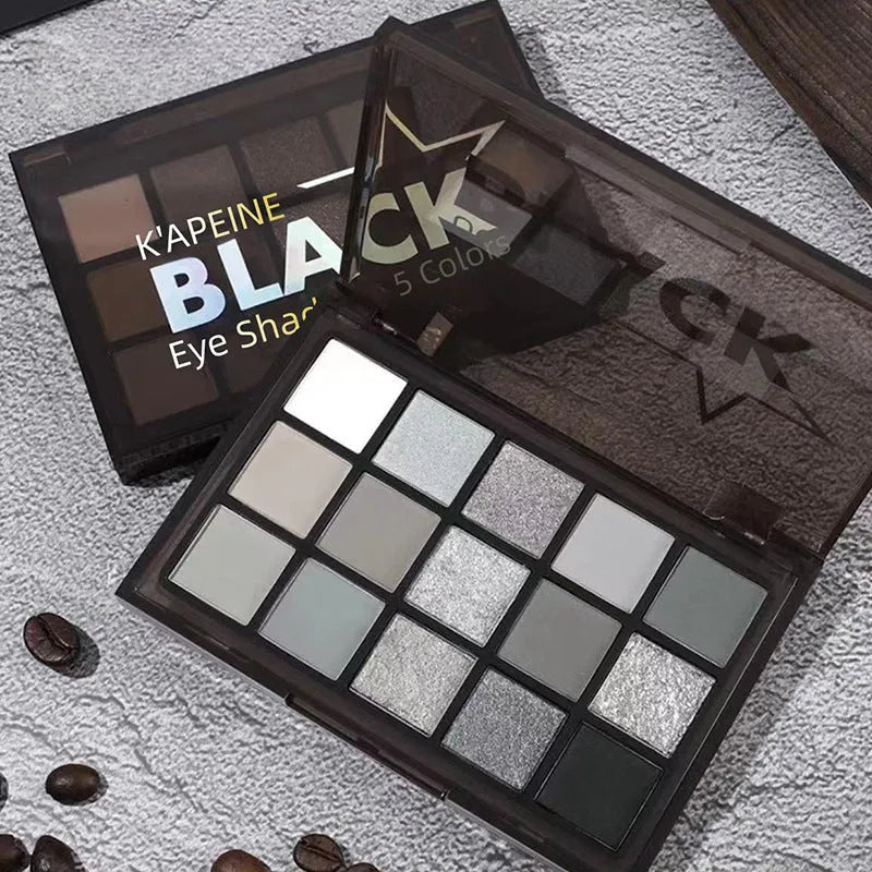 15-colour Night Elf eye shadow palette showing matte and shimmer pans in brown, blue, gray, and black shades.