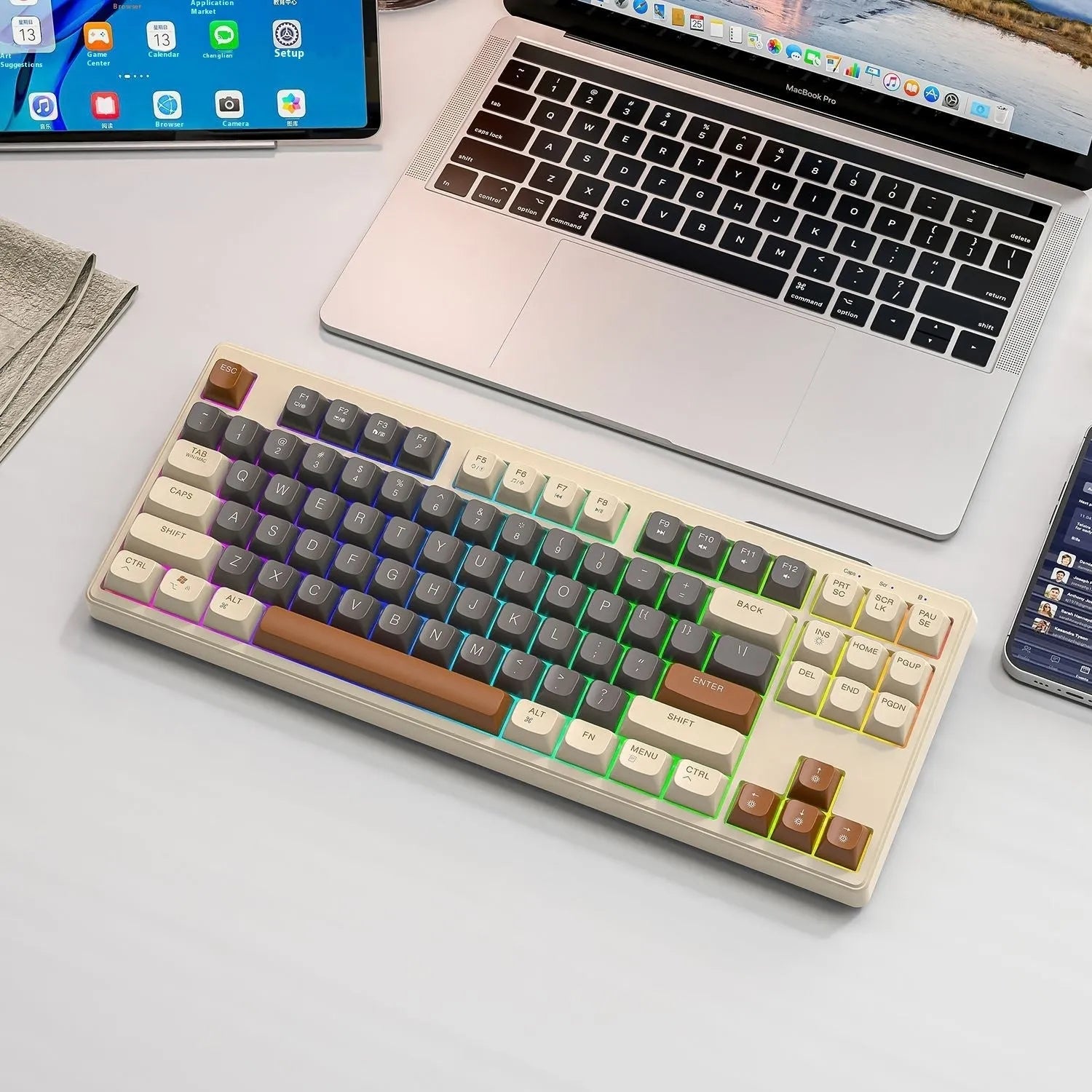 Free Wolf M87 wireless Bluetooth keyboard in blueberry colour on a desk with USB receiver and cable.
