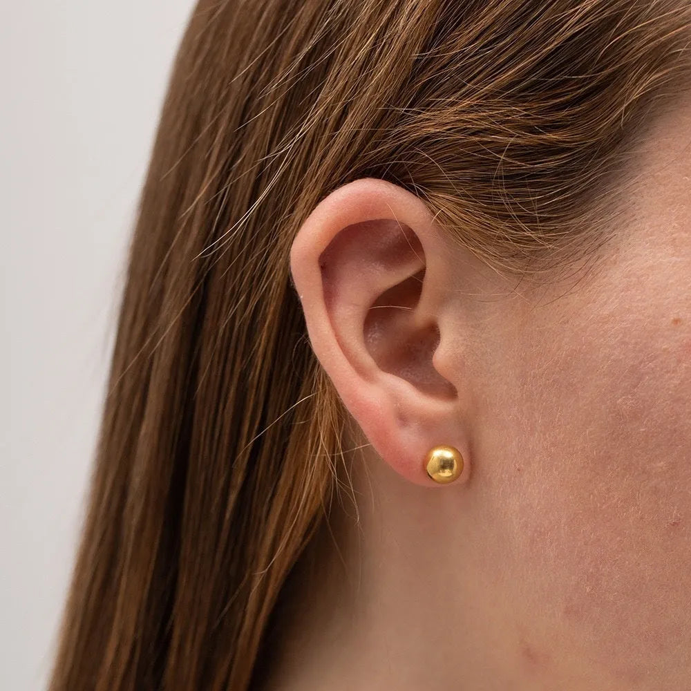 Minimalist stainless steel ball stud earrings in gold and silver tones, showing 3mm 4mm 5mm 6mm size difference.
