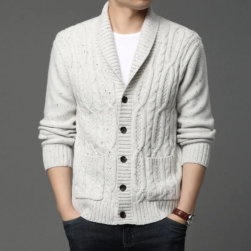 Men's knitted cardigan in jacquard pattern, shown in a neutral colour with a straight cut and open front.