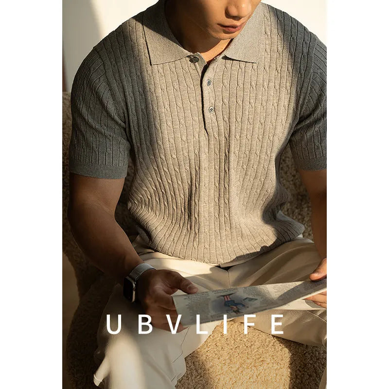 Men's khaki short sleeve business top on a hanger, showing the fabric texture and fit.