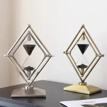 Metal-framed glass hourglass sand timer in bronze or silver with white or black sand