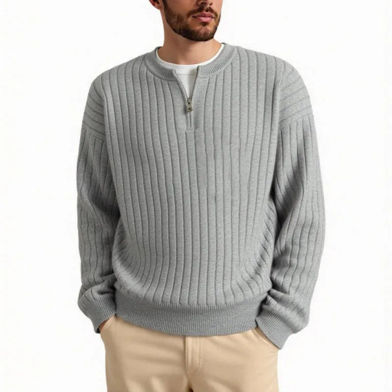 Men's grey loose fit half-zip pullover sweater with textured knit and long sleeves.