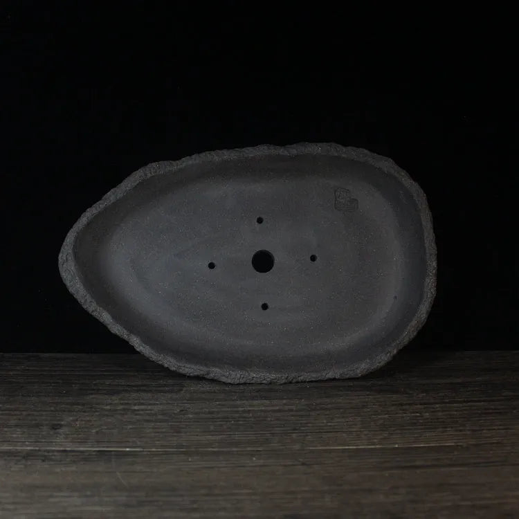 Handmade purple clay flower pot in floor-standing design with unique shape