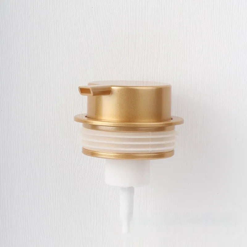 Foam pump facial cleanser dispenser with large plastic pump head in metallic finish