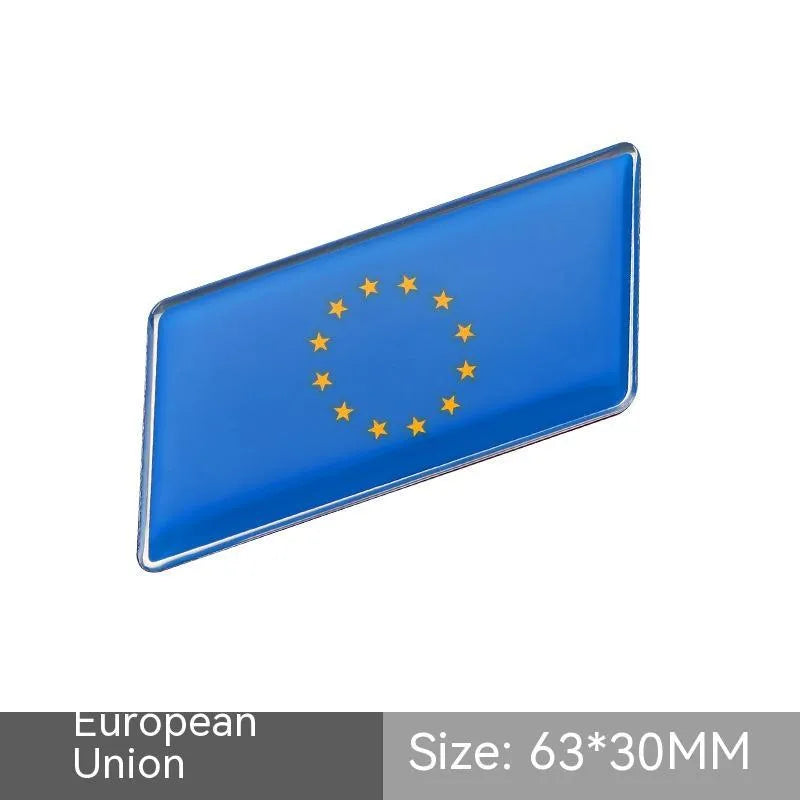 Aluminium metal car sticker with national flag design in a parallelogram shape.