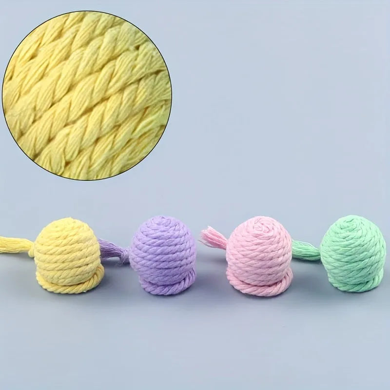 Green and pink soft plush cat toy balls with rope tails and internal bells