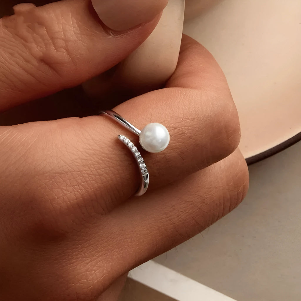 Sterling silver adjustable ring with freshwater pearl on open-loop design