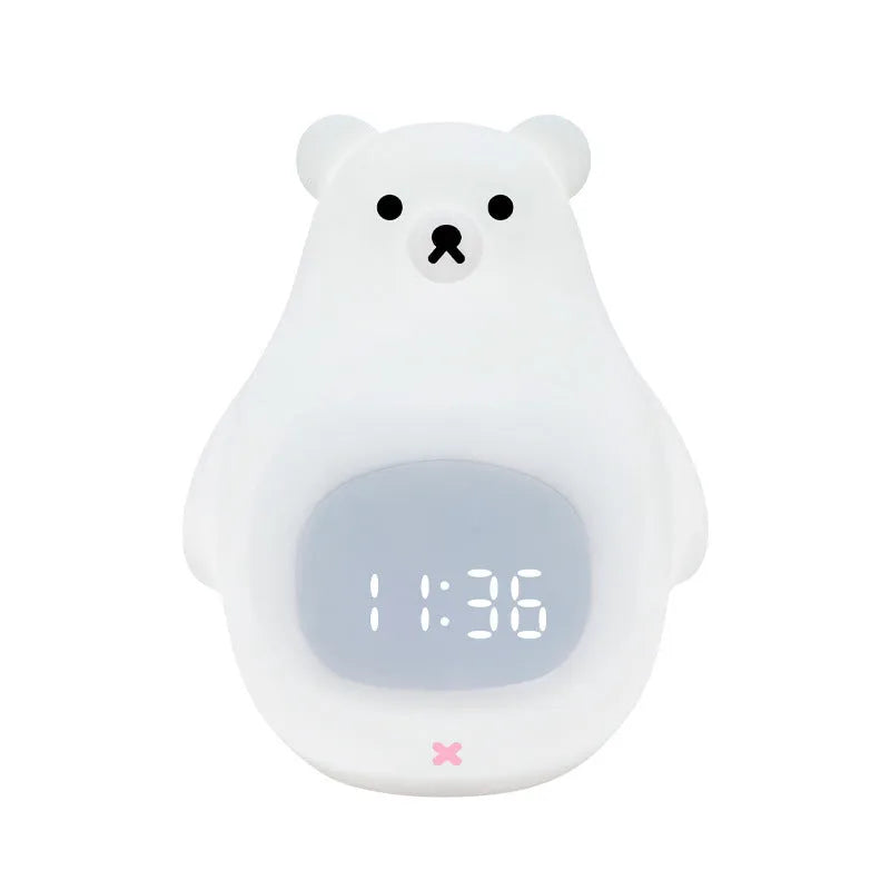 White silicone bear-shaped night light with timer and alarm clock functions on a bedside table.