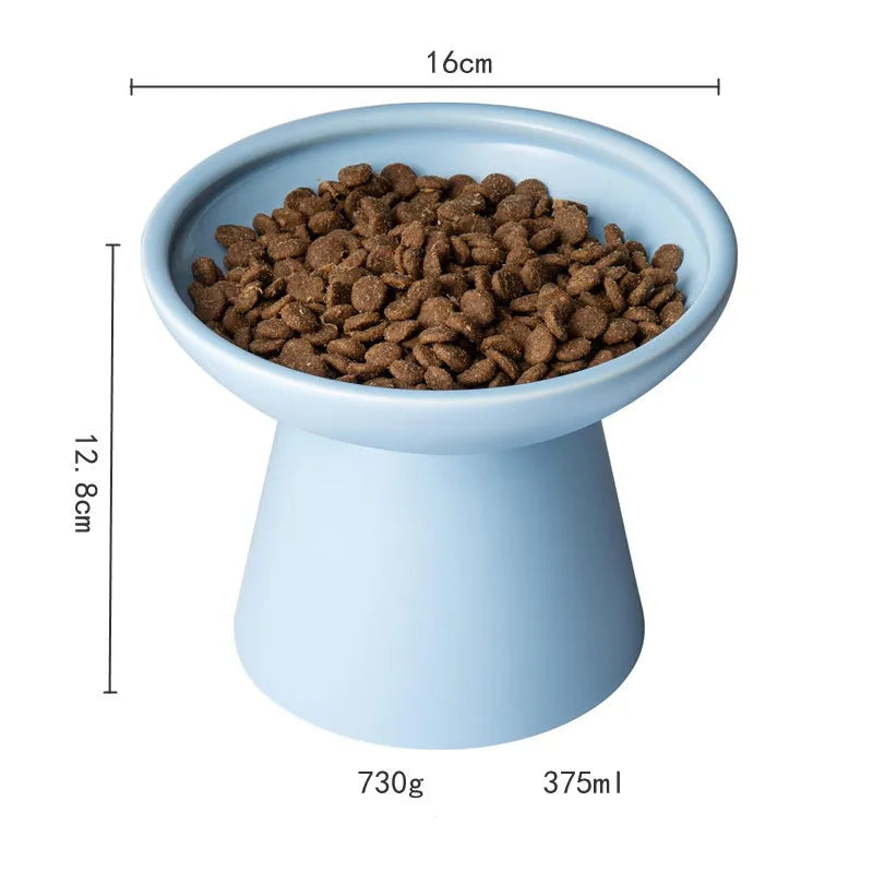 Blue ceramic elevated cat food bowl with wide shallow design next to a matching water bowl.