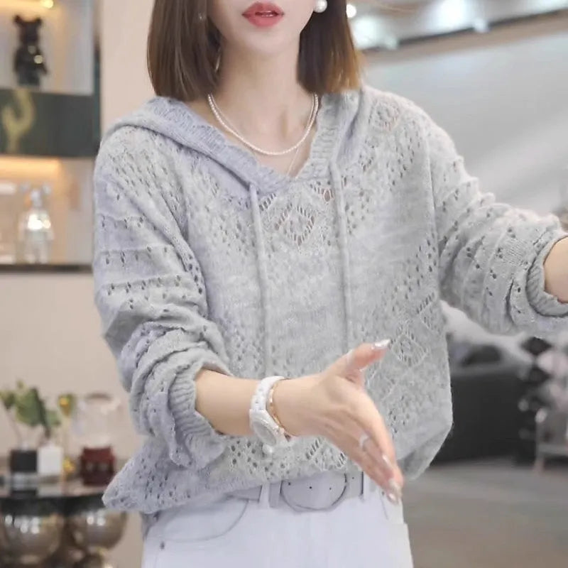 Women's loose grey hollow crochet hooded longsuit undershirt pullover with long sleeves.