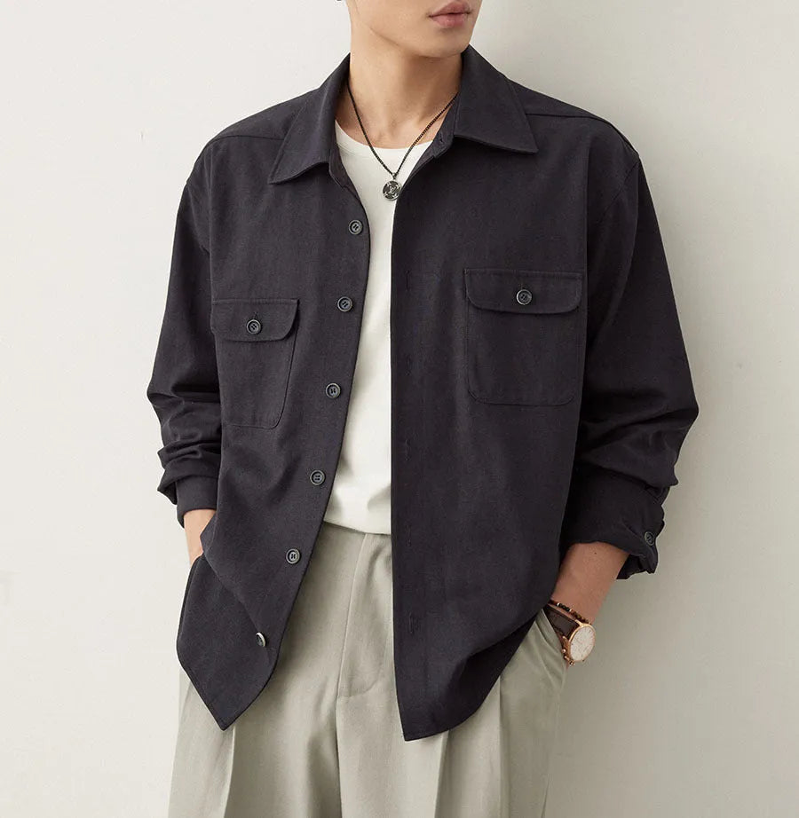 Men's light sand rice coloured long sleeve shirt with a lapel collar, laid flat to show front design.