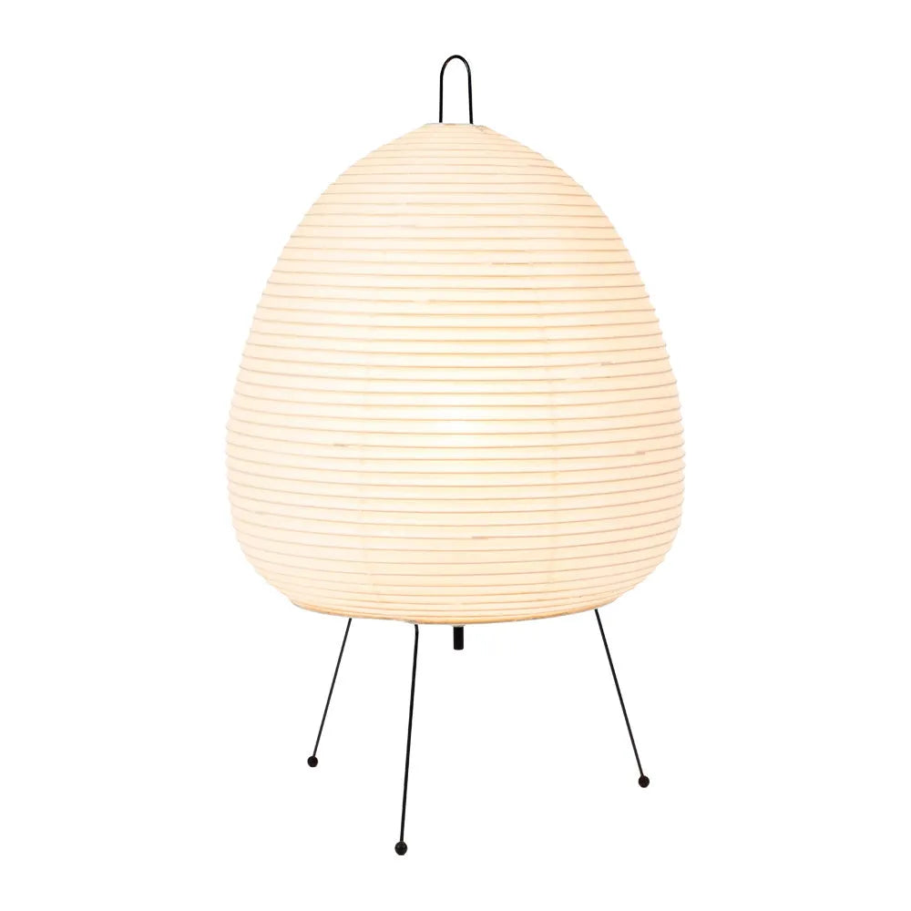 Japanese style handmade rice paper lantern table lamp with aluminium base on a wooden table.