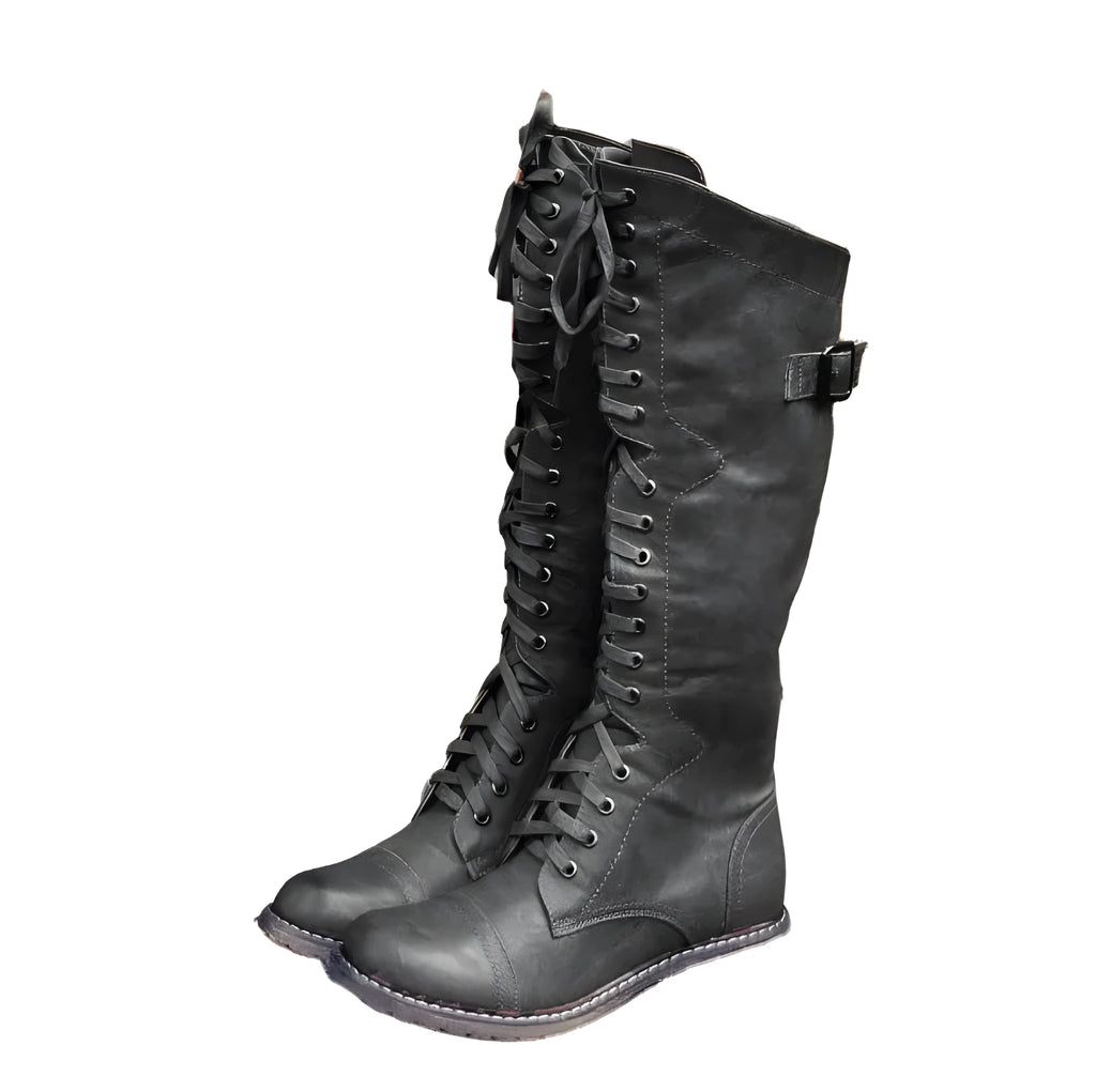 Women's black cross strap knight boots made from artificial PU.