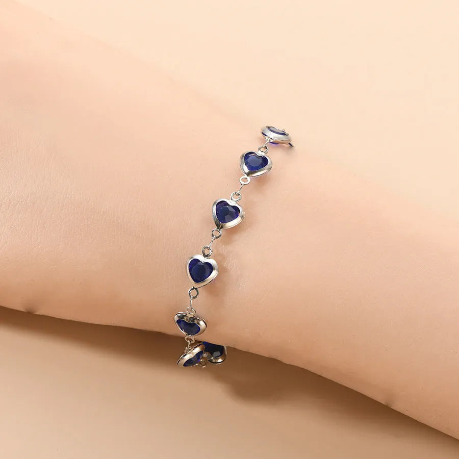 Devil's Eye geometric heart bracelet in stainless steel showing six colour options on white background