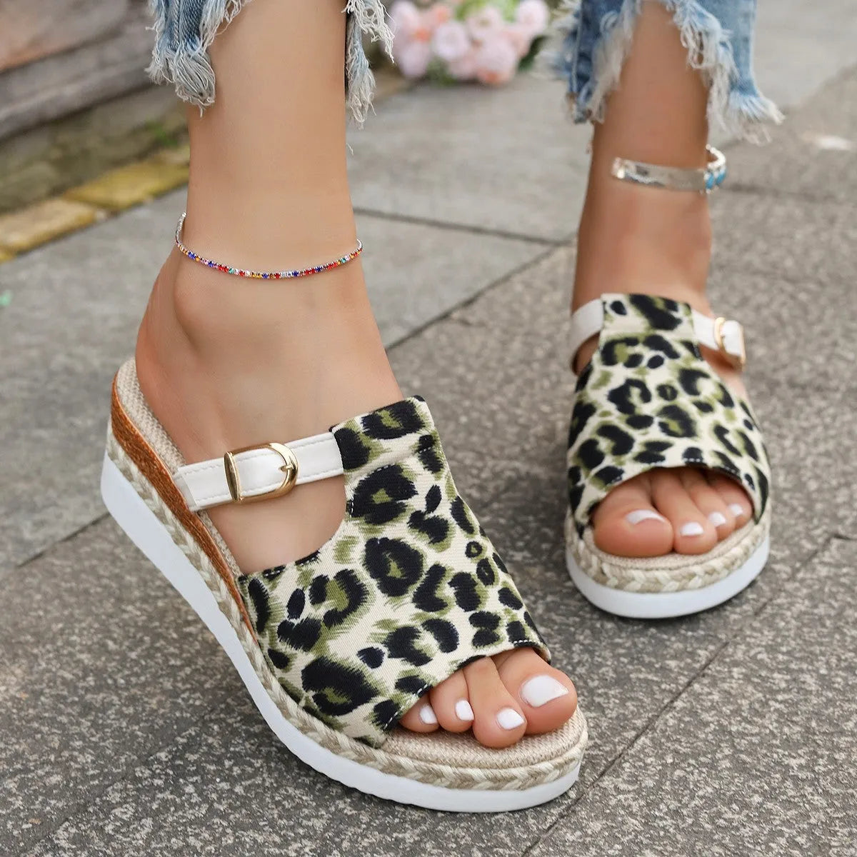 Leopard print wedge platform sandals with a fish mouth toe on a rubber sole.