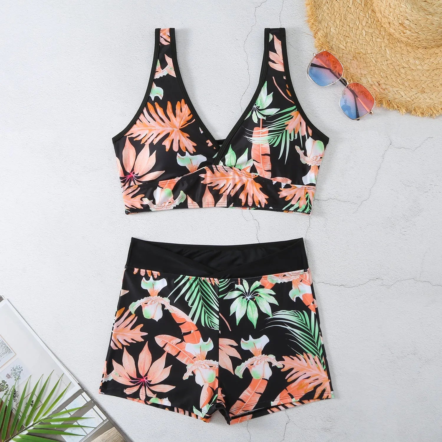 Women's two-piece swimsuit set with sleeveless top and printed boxer-style briefs in multiple colours.