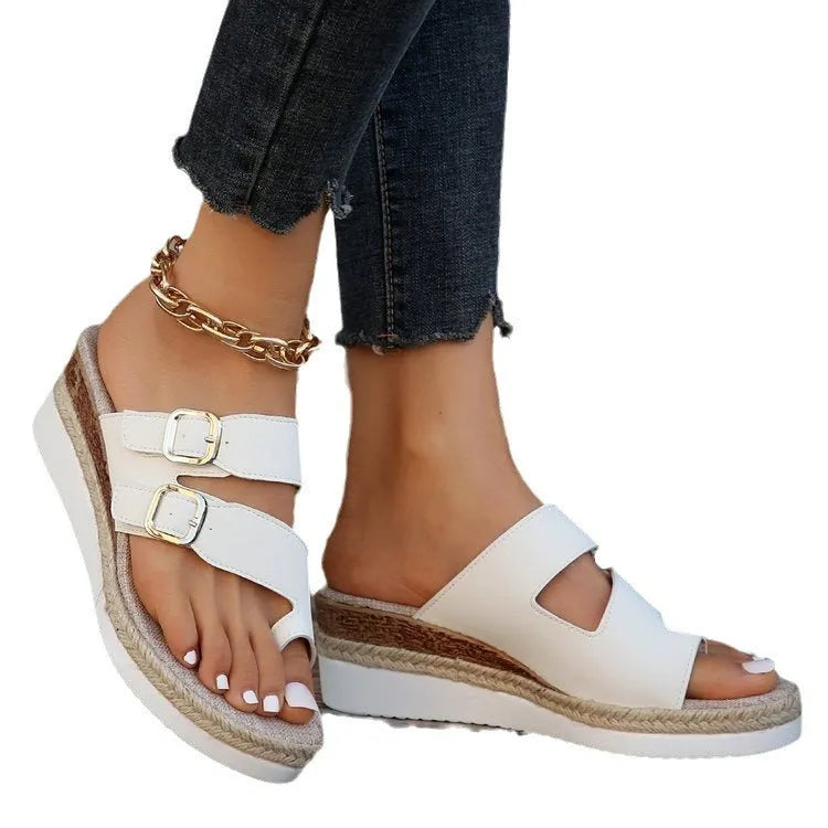 White woven patent leather peep toe wedge sandals on a rubber sole
