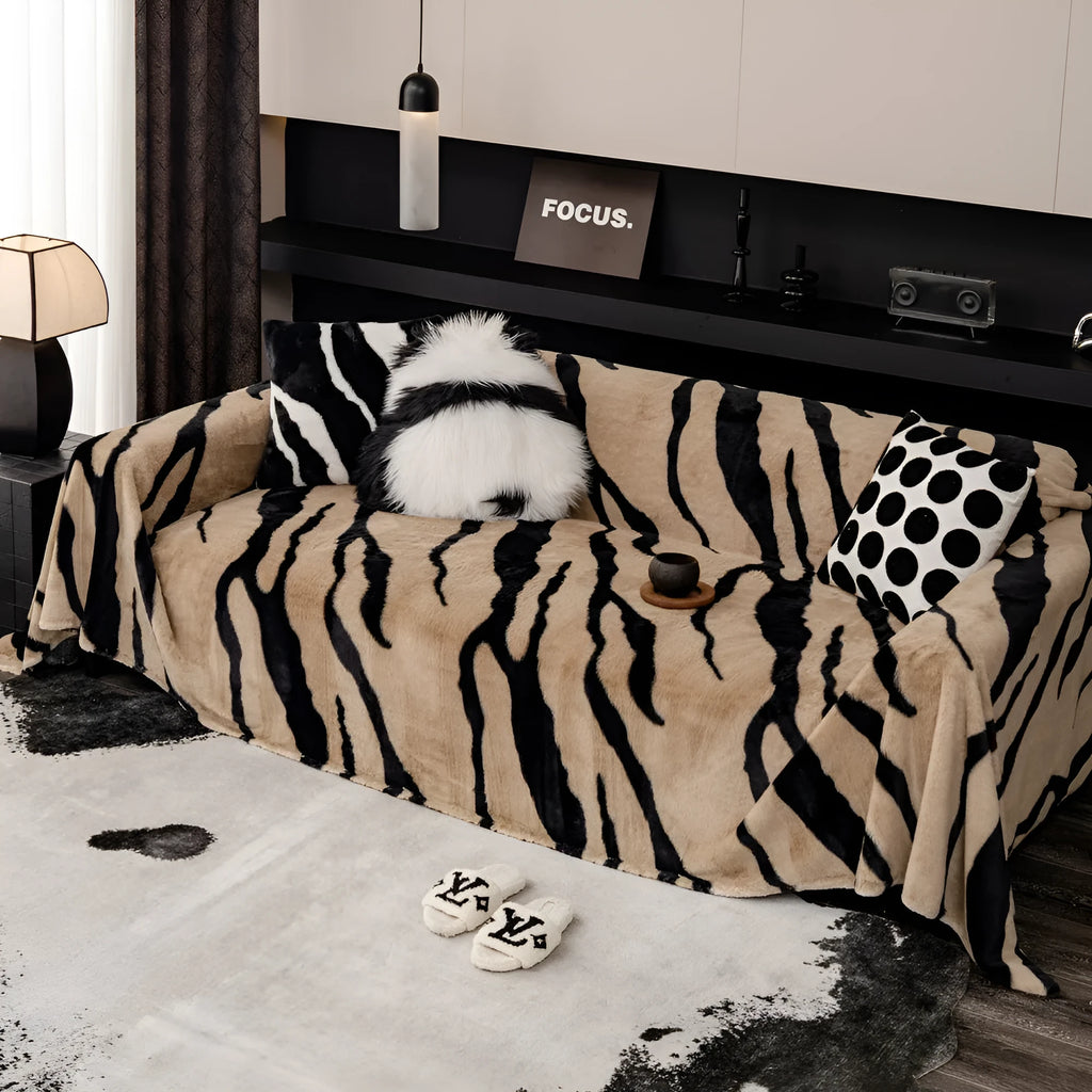 Zebra pattern non-slip flannel sofa cover with matching pillowcase in caramel colour.