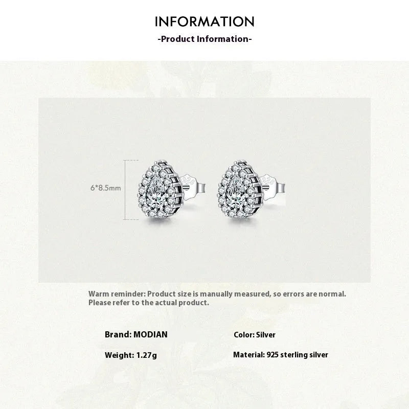 Women's silver water drop ear studs in 925 sterling silver with diamond treatment