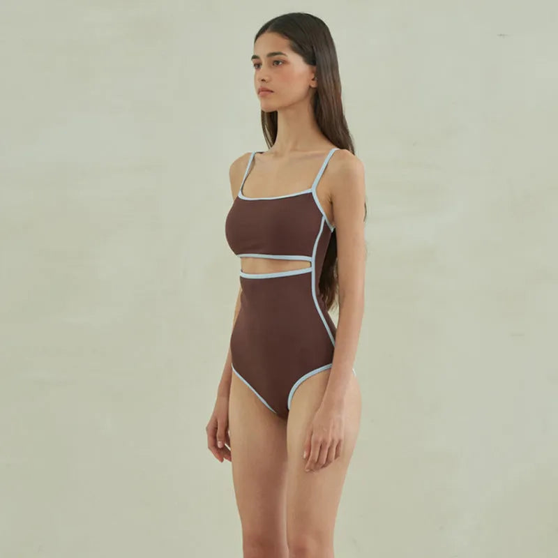 Brown one-piece swimsuit for women with triangle neckline on a mannequin