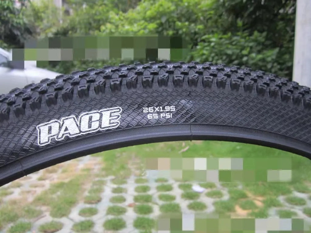 Ultralight puncture-proof mountain bike tyre shown in black with aggressive tread pattern.