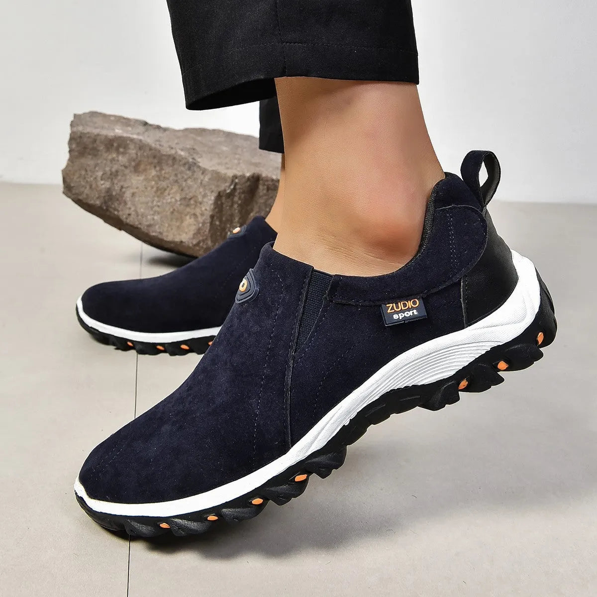 Men's thin slip-on overshoe covers in grey, blue, light brown, green, and black colours on a rubber sole.