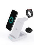 Black 3-in-1 wireless charging station for phone, AirPods and iWatch on a desk.