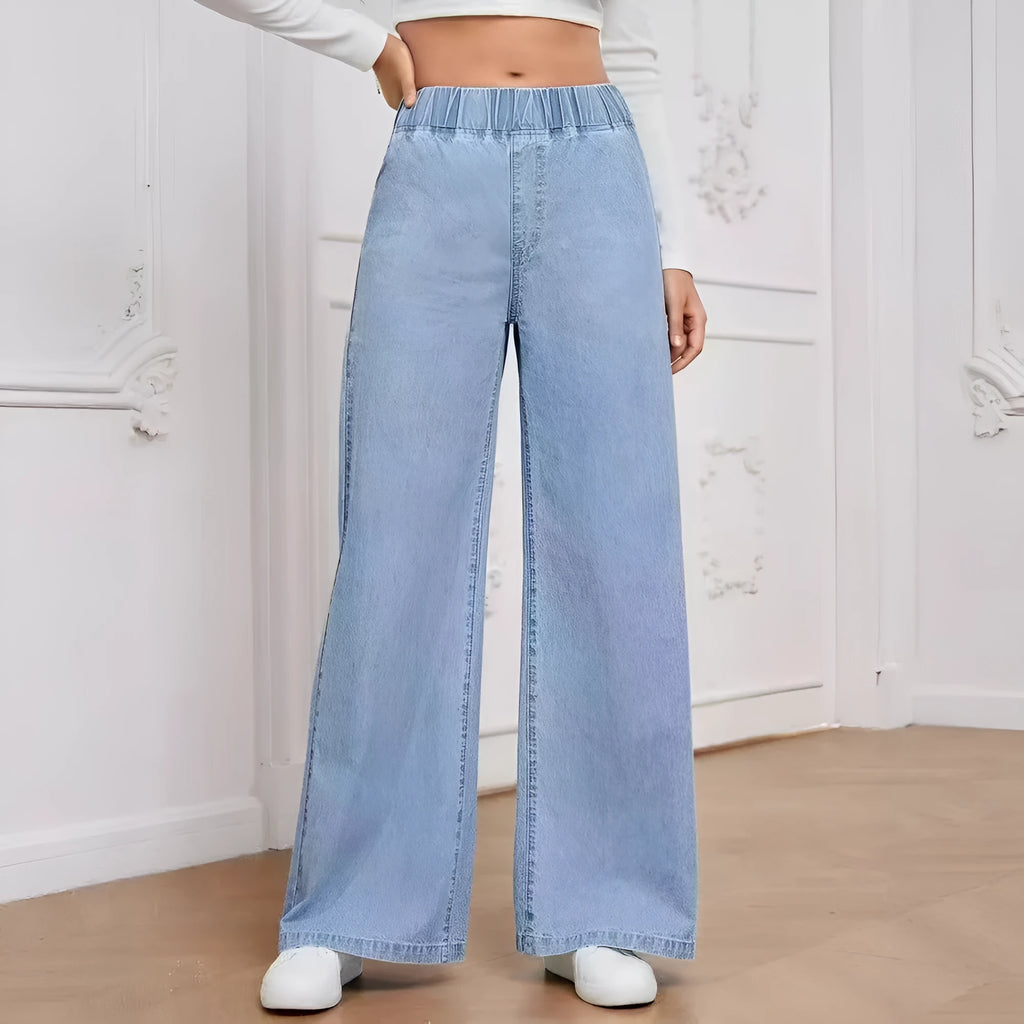 Plus size light blue washed denim jeans with wide leg straight cut and zip fly