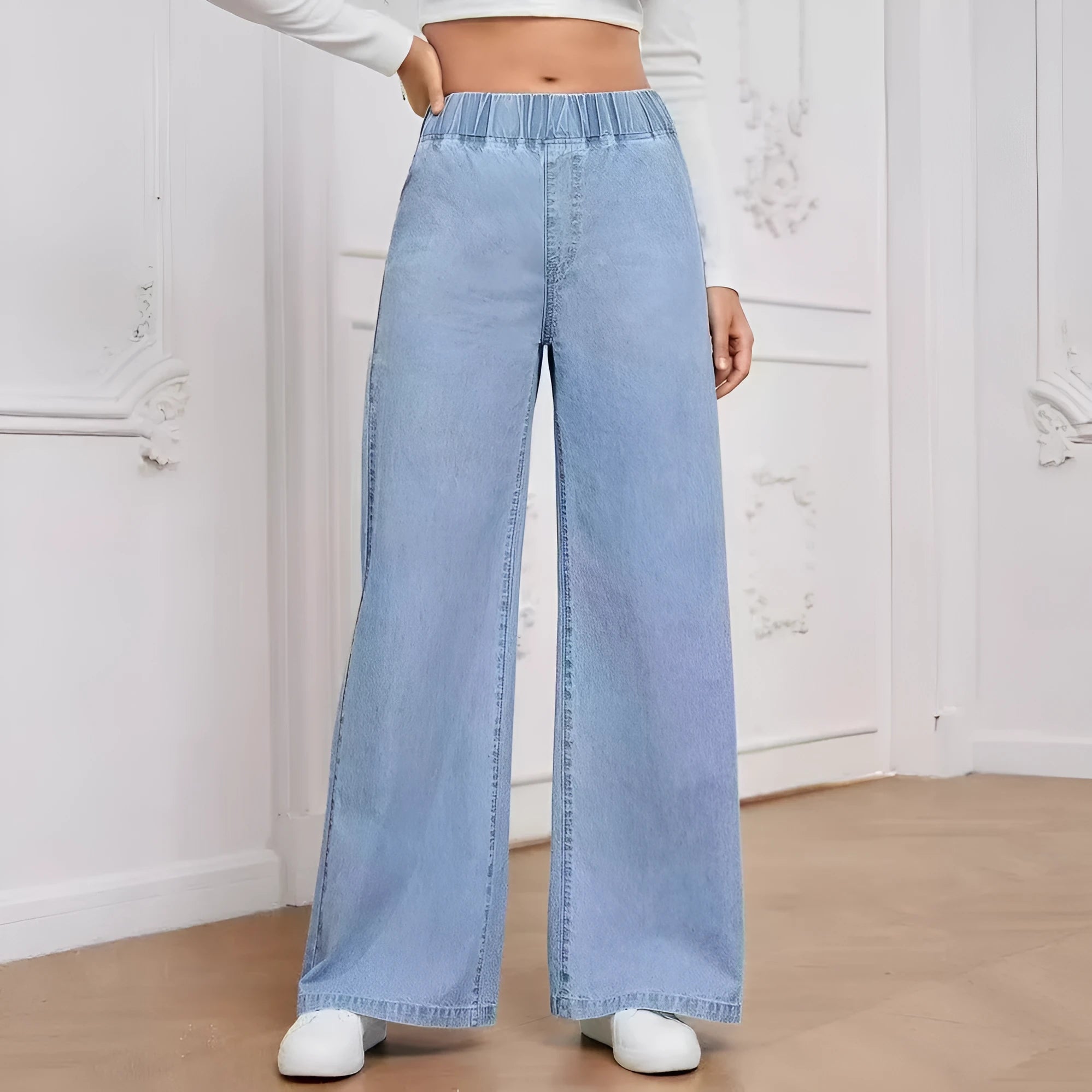 Plus size light blue washed denim jeans with wide leg straight cut and zip fly