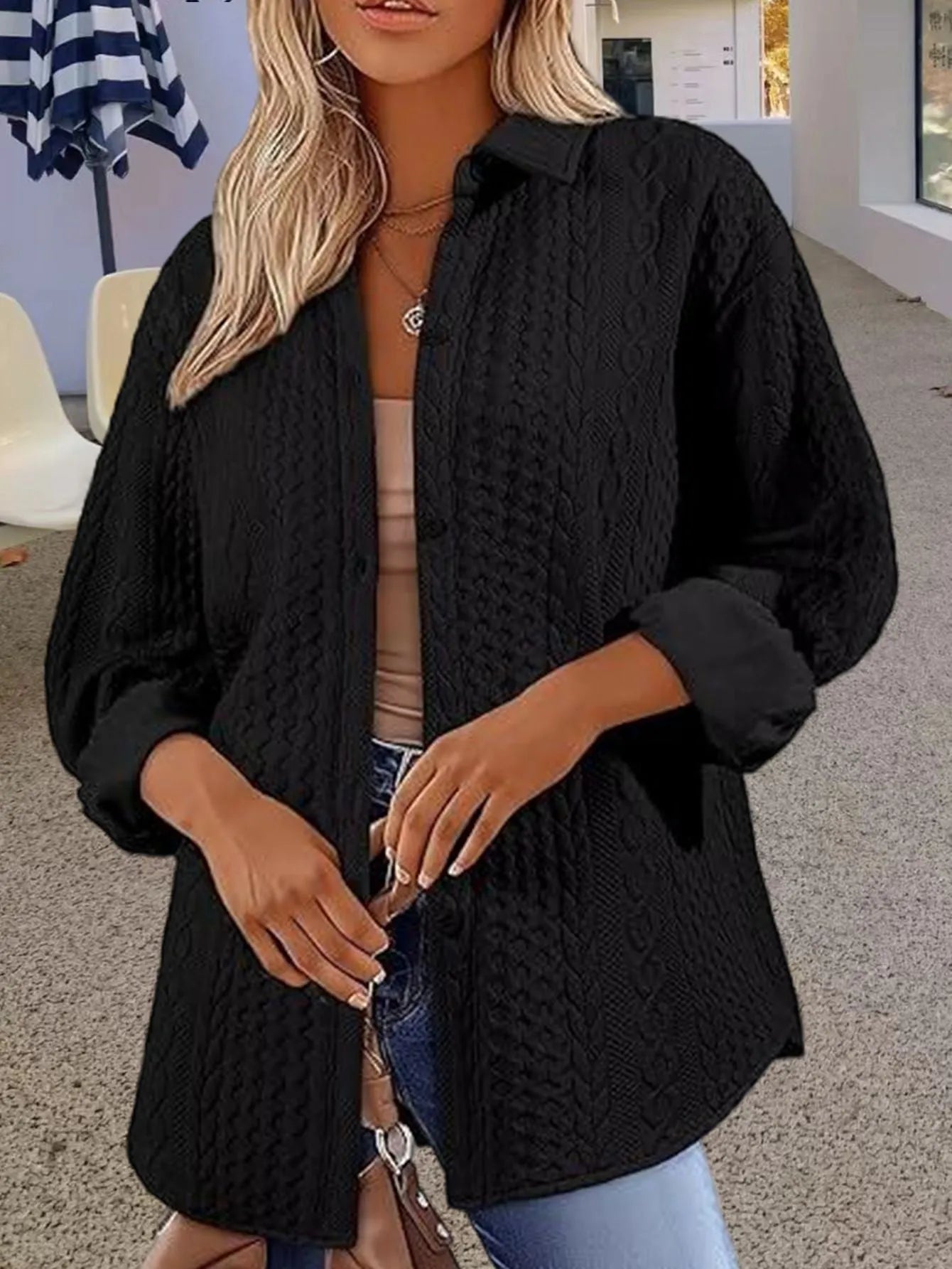 Women's solid colour long-sleeved knit cardigan in black, shown open as a layering piece.