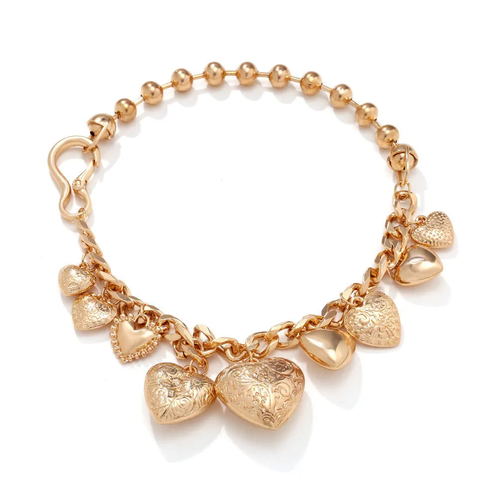 Exaggerated carved heart pendant necklace in gold or white K on an adjustable metal chain.