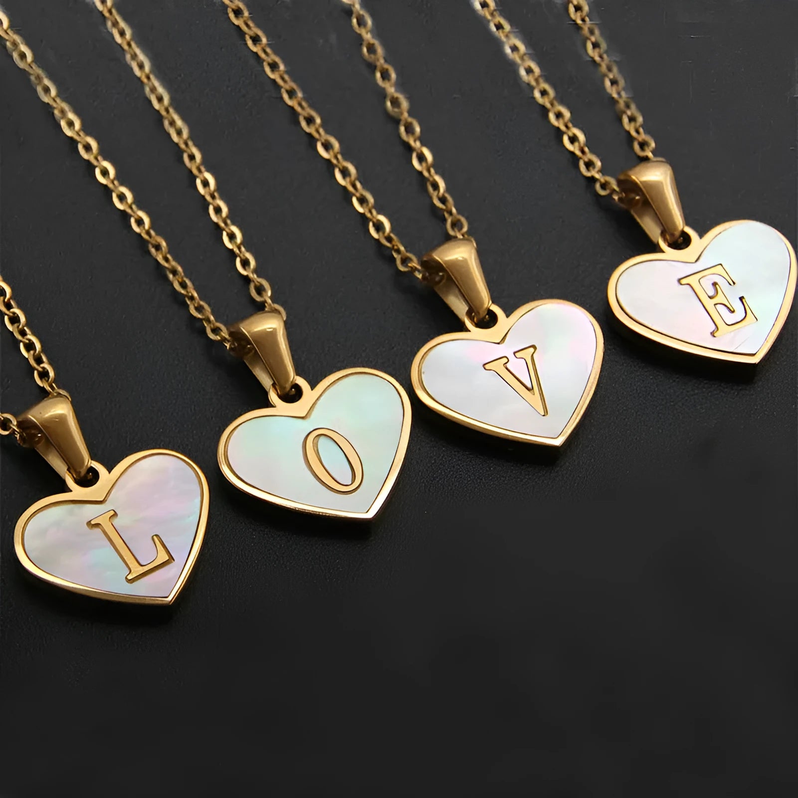 Gold plated heart-shaped personalised necklace with white shell charm on an adjustable chain.
