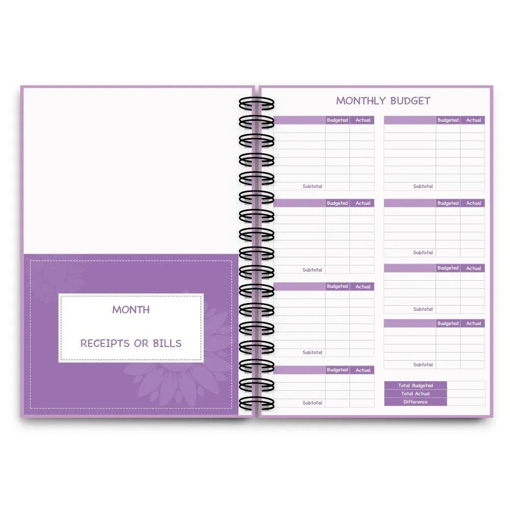 Purple A6 coil-bound budget notebook with pen and financial planning accessories