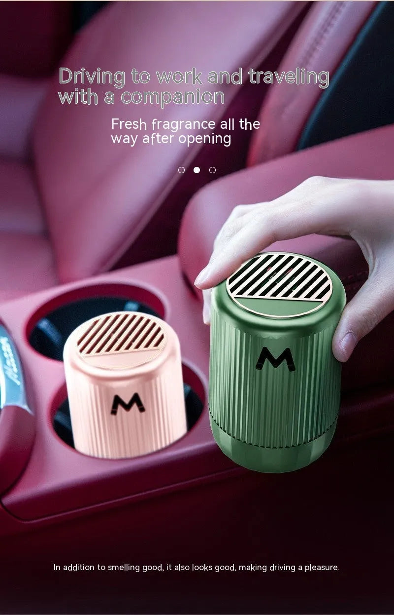 Solid car aromatherapy cup in choice of four fragrances on a 10cm by 6cm base.