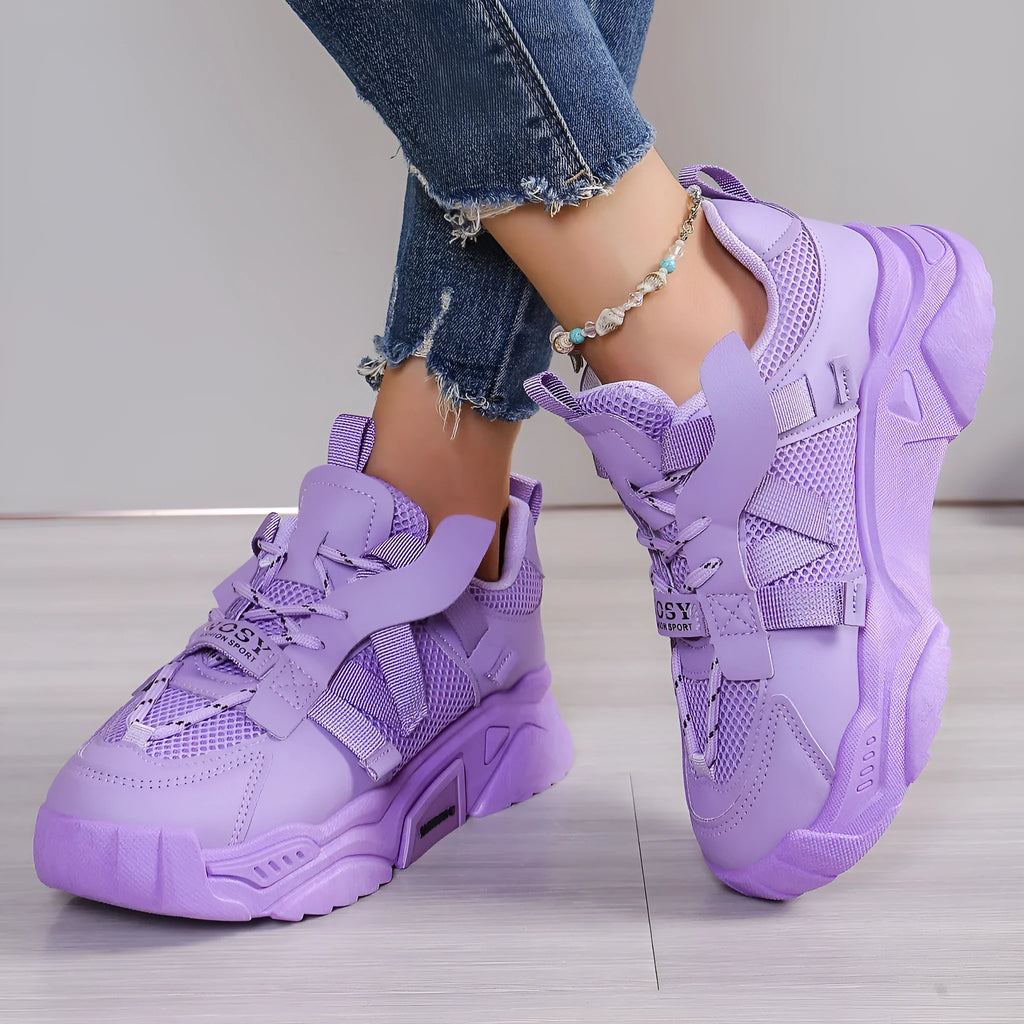 Women's purple platform mesh dad shoes with animal pattern and lace-up front.