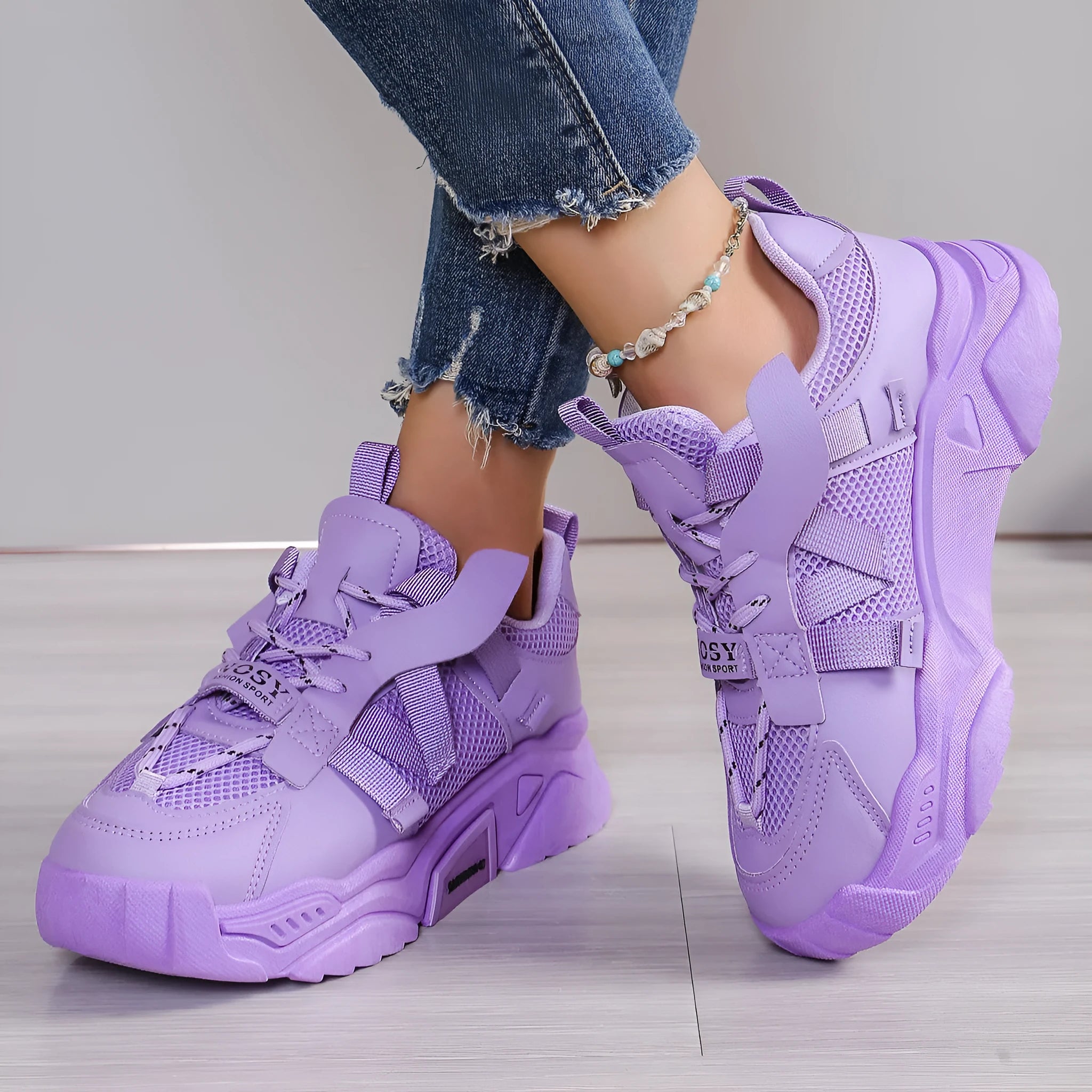 Women's purple platform mesh dad shoes with animal pattern and lace-up front.