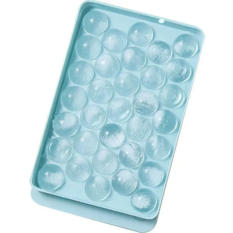 Blue silicone ice cube tray with lid showing 33 round grids for homemade ice making