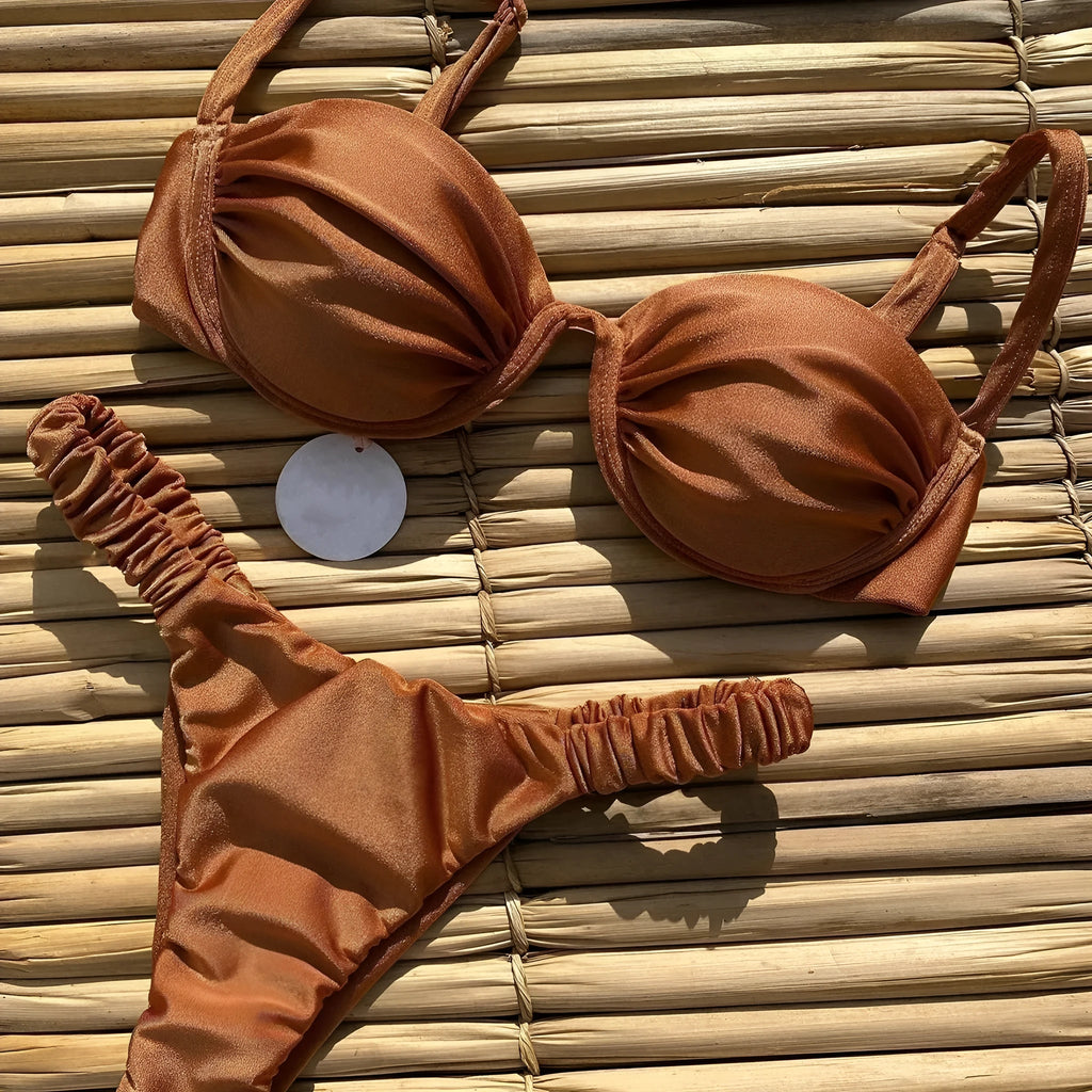 Women's black underwire bikini swimsuit with split briefs, shown on mannequin