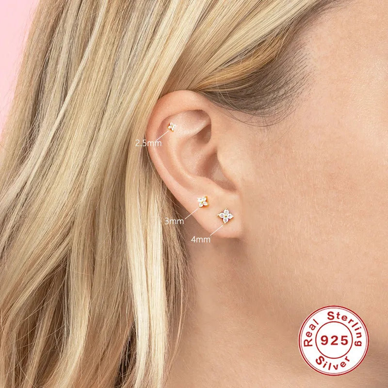 S925 sterling silver stud earrings with a small crystal flower design in gold or platinum plating.